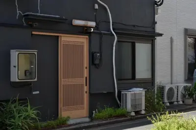 a building with a wooden door on the side of it at \u68ee\u4e0b\u5225\u90b8 in Tokyo