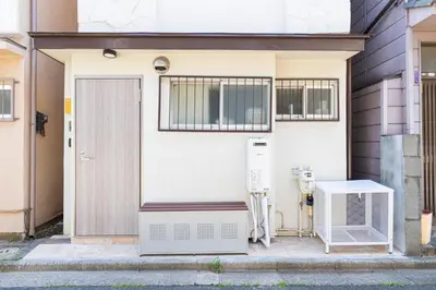 a white house with a heater and a door at \u30d9\u30eb\u9418 in Tokyo