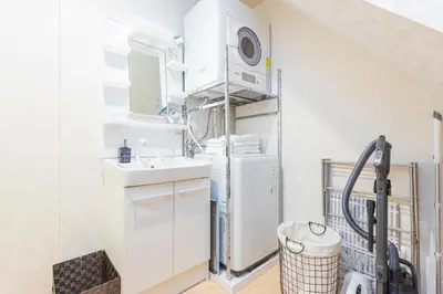 a kitchen with a sink and a refrigerator at \u30d9\u30eb\u9418 in Tokyo
