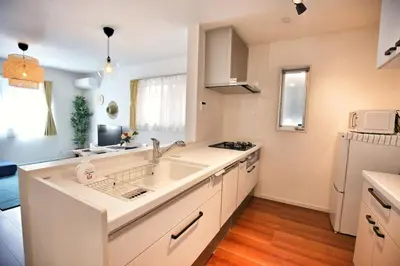 a white kitchen with a sink and a refrigerator at XD54321 The 100-square-meter super-large villa near Tokyo Skytree can accommodate 8 people! in Tokyo