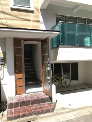 an open door of a building with a bike in it at 2\u6c60\u888b\u6700\u4e2d\u5fc3 \u4e24\u5ba4\u4e00\u5385 \u6c60\u888b\u7ad910\u5206 2 rooms Ikebukuro center 10 mins to ST Max 7P \u76f4\u8fbe\u65b0\u5bbf \u6d89\u8c37 \u8868\u53c2\u9053 \u6c60\u888b \u4e0a\u91ce \u4ee3\u4ee3\u6728 \u94f6\u5ea7 \u539f\u5bbf in Tokyo