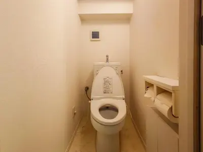 a small bathroom with a toilet with the lid up at JING HOUSE Shintakasago - Vacation STAY 17117 in Tokyo