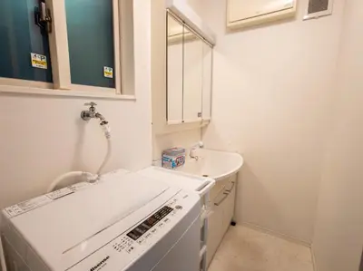 a kitchen with a washing machine and a sink at JING HOUSE Shintakasago - Vacation STAY 17117 in Tokyo