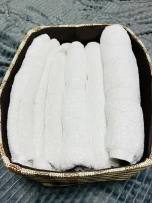 a box of white towels sitting on a bed at Lucerne - Vacation STAY 17128 in Tokyo