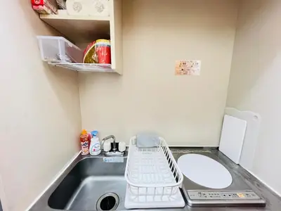 a small kitchen with a sink and a toilet at Lucerne - Vacation STAY 17128 in Tokyo