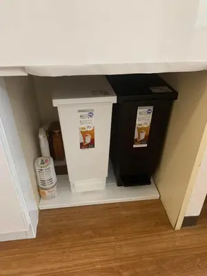 a shelf in a room with two boxes of food at Lions B in Tokyo