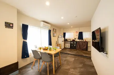 a kitchen and dining room with a table and chairs at -花雷 はならい in 浅草&雷門- 浅草駅から徒歩5分 ベビー用品付き ファミリーも歓迎 大人8名もOK!! in Tokyo