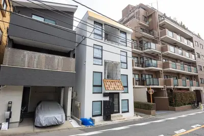an apartment building on a city street at Recorrido Yoyogi in Tokyo