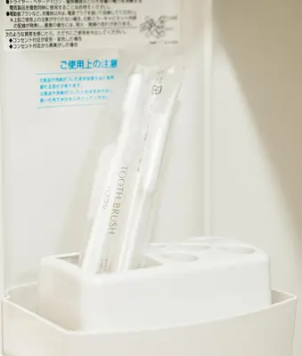 a package of toothbrushes in a container in a refrigerator at \u6771\u4eac\u30ea\u30ea\u30a2\u30eb\u30db\u30c6\u30eb 301 in Tokyo