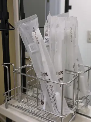 a metal basket with white bags on a counter at Space Noa201 in Tokyo