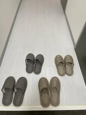a group of four pairs of slippers on a floor at Space Noa201 in Tokyo