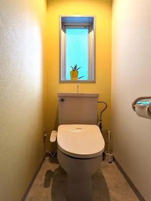 a bathroom with a toilet and a window at Space Noa201 in Tokyo