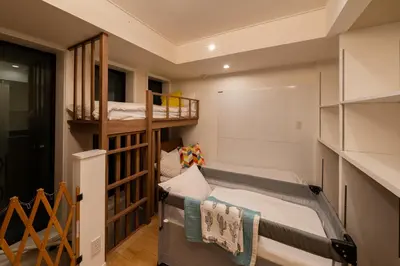 a small room with a bunk bed and a ladder at Villa Shibuya East , \u6e0b\u8c37\u6771\u30f4\u30a3\u30e9 in Tokyo