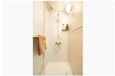 a white bathroom with a shower and a toilet at 64, Shiomi , Second floor of the apartment, \u6f6e\u898b2F in Tokyo