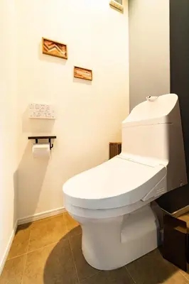 a bathroom with a white toilet in a room at 63, Shiomi, First floor of the apartment, \u6f6e\u898b1F in Tokyo