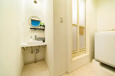 a bathroom with a sink and a mirror at 63, Shiomi, First floor of the apartment, \u6f6e\u898b1F in Tokyo