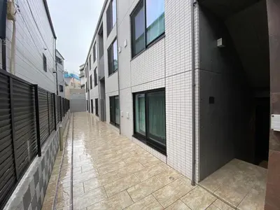 an empty hallway of a building with a sidewalk at The best choice for accommodation in Yoyogi SoYk in Tokyo