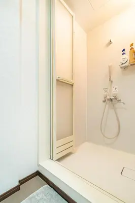 a shower with a glass door in a bathroom at 79, Umejima, Entire house for rent, \u6885\u5cf6 in Tokyo