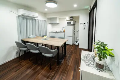 a kitchen and dining room with a table and chairs at 93, Yotsugi Seven, Entire house for rent, \u56db\u3064\u6728\u30bb\u30d6\u30f3 in Tokyo