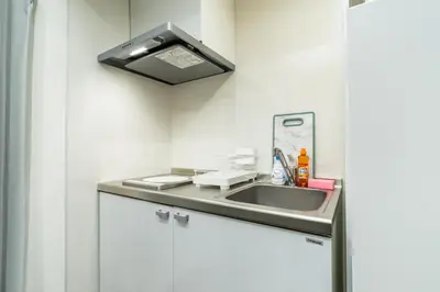 a bathroom with a sink and a light at 93, Yotsugi Seven, Entire house for rent, \u56db\u3064\u6728\u30bb\u30d6\u30f3 in Tokyo