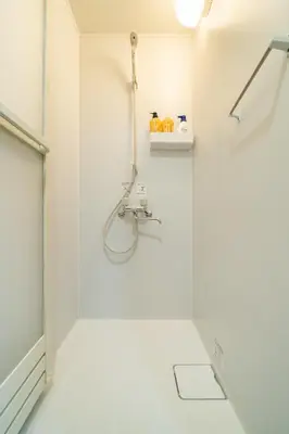 a white bathroom with a shower and a sink at 93, Yotsugi Seven, Entire house for rent, \u56db\u3064\u6728\u30bb\u30d6\u30f3 in Tokyo