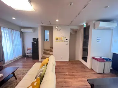 a living room with a couch and a table at new open shinjuku house SJ0430 in Tokyo