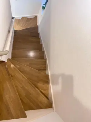 a staircase with wood floors and a white wall at new open shinjuku house SJ0430 in Tokyo