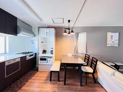 a kitchen and dining room with a table and chairs at new open shinjuku house SJ0430 in Tokyo
