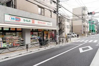 a store on the side of a city street at \u9326\u7cf8\u753a\u30b9\u30ab\u30a4\u30a8\u30a4\u30c8 in Tokyo