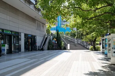 an empty street in front of a building at \u9326\u7cf8\u753a\u30b9\u30ab\u30a4\u30a8\u30a4\u30c8 in Tokyo