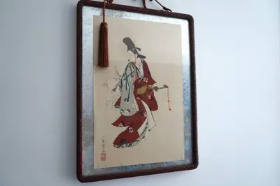a picture of a woman in a kimono on a wall at Private Hotel Asakusa in Tokyo