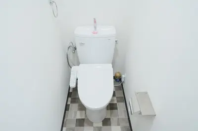 a bathroom with a white toilet in a stall at \u6771\u4eac\u30ea\u30ea\u30a2\u30eb\u30db\u30c6\u30eb201 in Tokyo