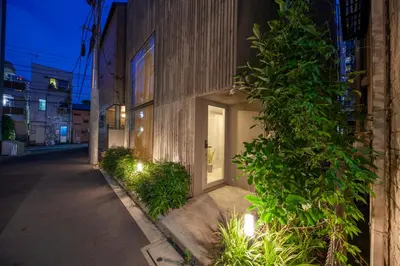 a building with a door on the side of a street at Premier suite New Shinjuku Kagurazaka front in Tokyo