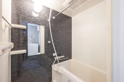 a bathroom with a bath tub and a sink at Arucia\u4e09\u8ed2\u8336\u5c4b in Tokyo
