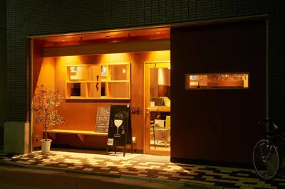 a store front at night with its door open at \u5bcc\u58eb\u306e\u9593 401 in Tokyo