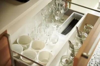 a drawer filled with wine glasses and dishes at \u5bcc\u58eb\u306e\u9593 401 in Tokyo