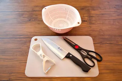 a pair of scissors on a cutting board with a fan at TOMARIE Horikiri Residential Suite in Tokyo