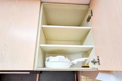 a cupboard with a tea set in it at \u834f\u539f\u4e2d\u5ef6\u99c5\u304b\u30893\u5206,\u5e83\u3005LDK,\u8cb8\u5207,\u54c1\u5ddd\u99c5\u307e\u306720\u5206,comfortable in Tokyo