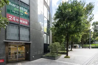 a building with a tree in front of it at Link COURT\u897f\u65b0\u5bbf in Tokyo