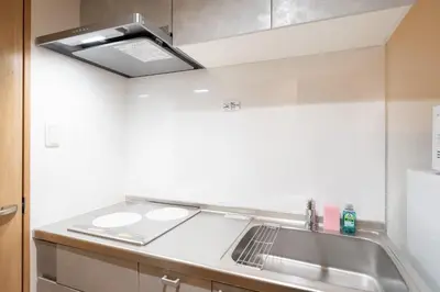 a kitchen with a sink and a stove at \u30a2\u30a4\u30ea\u30b9\u62bc\u4e0a in Tokyo
