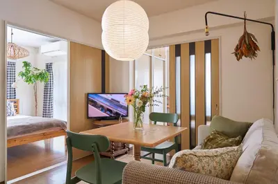 a living room with a couch and a table at Liberty house 7ppl in Tokyo