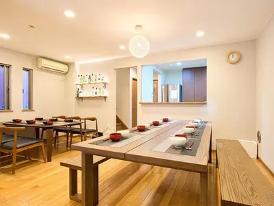 a living room with a table with bowls on it at KandoStay TOKYO\u30c6\u30e9\u30b9 in Tokyo