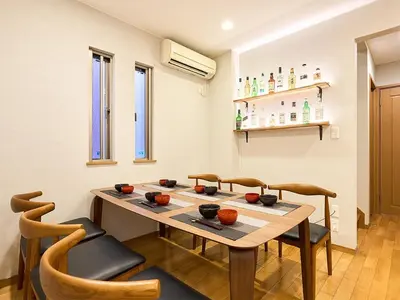 a dining room with a table and chairs at KandoStay TOKYO\u30c6\u30e9\u30b9 in Tokyo