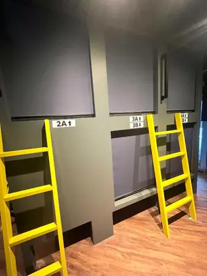 a room with two yellow ladders and a wall at \u65b0\u5bbf\u30cb\u30c3\u30ab\u30db\u30c6\u30eb in Tokyo