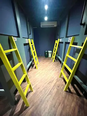 a room with yellow ladders in a room with wooden floors at \u65b0\u5bbf\u30cb\u30c3\u30ab\u30db\u30c6\u30eb in Tokyo