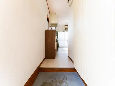 a hallway with white walls and a floor and a door at Kosuge Sta 6min walk Ueno Sta 10min Switch in Tokyo