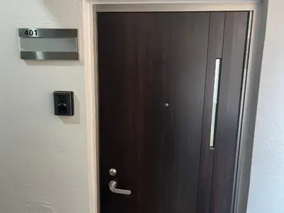 a wooden door with a handle in a room at Ikebukuro Area 41 NishiikeApartment in Tokyo