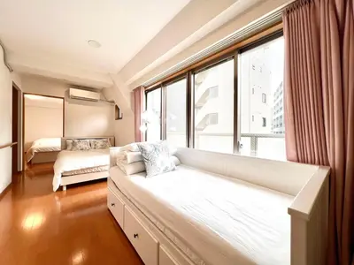 a living room with a couch and a large window at Nishiwaseda 501-SJ0185 in Tokyo