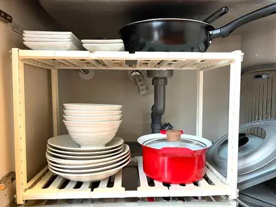 a shelf with plates and bowls and a pot at Nishiwaseda 501-SJ0185 in Tokyo