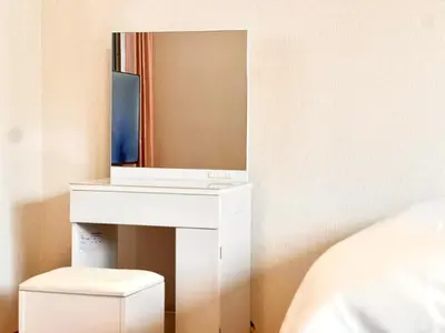 a white dressing table with a mirror and a stool at Nishiwaseda 501-SJ0185 in Tokyo
